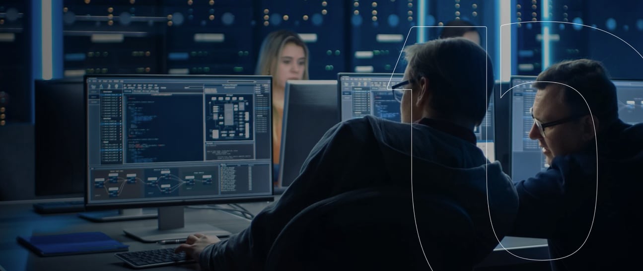 Two men looking at computer screen